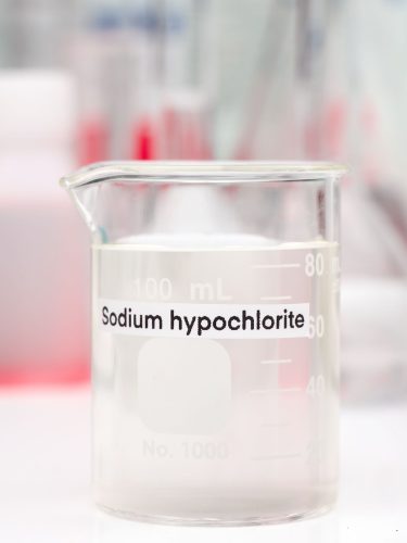 Close up of sodium hypochloride liquid used for water treatment