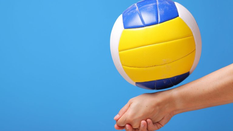 Close up of volleyball on sandy beach court