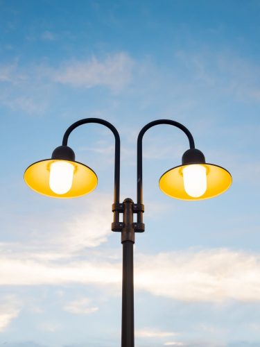 Close up view of a galvanized steel street light pole