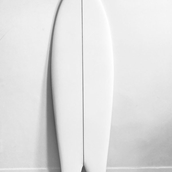 Durable solar powered surf board on the beach during sunset