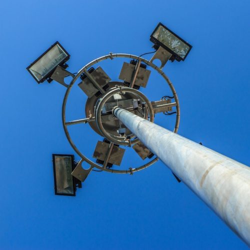 Durable stadium mast pole supporting LED floodlights
