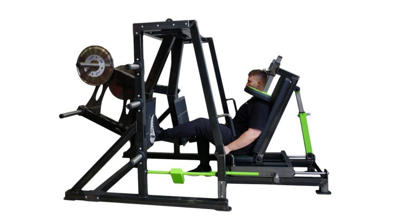 Fitness enthusiast using leg press for muscle building