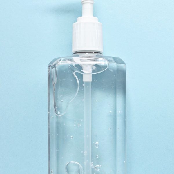 Hand sanitizer bottle with pump on white background