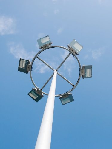 High mast pole installed at industrial site for large area lighting