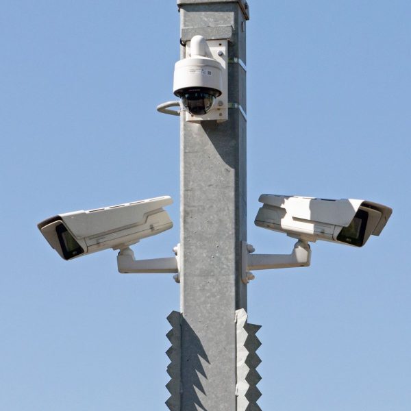 Modern CCTV camera pole setup in a residential neighborhood