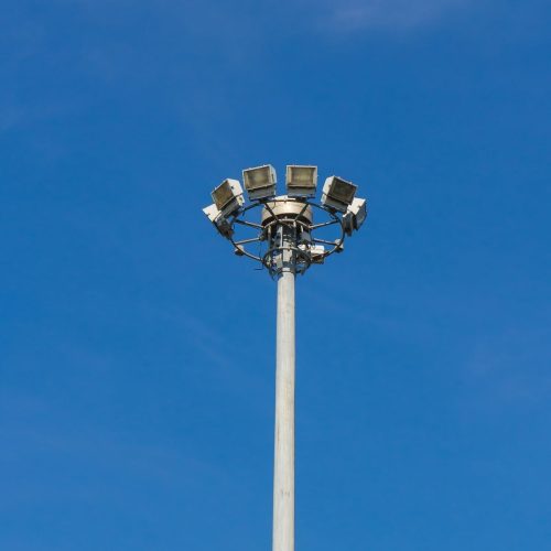 Modern street light pole with solar panel in an urban area