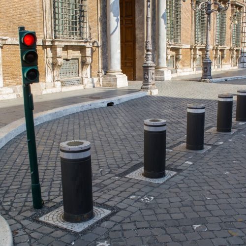 Outdoor LED bollard light illuminating garden pathway at night