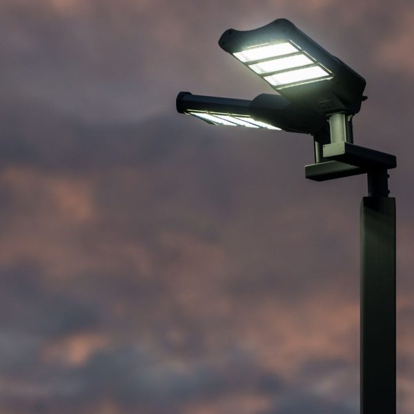 Outdoor lens flood lights for large area illumination