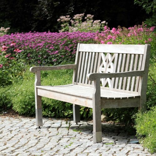 RCC garden bench with backrest placed in a landscaped park