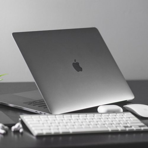 Sleek silver laptop with high resolution display on a wooden desk