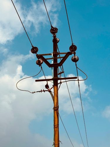 Solar high mast pole installed in a large outdoor parking area