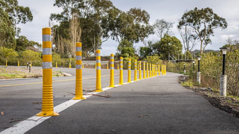 Solar powered bollard lighting a commercial walkway