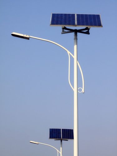 Solar street light installed on a city road for energy efficient night lighting