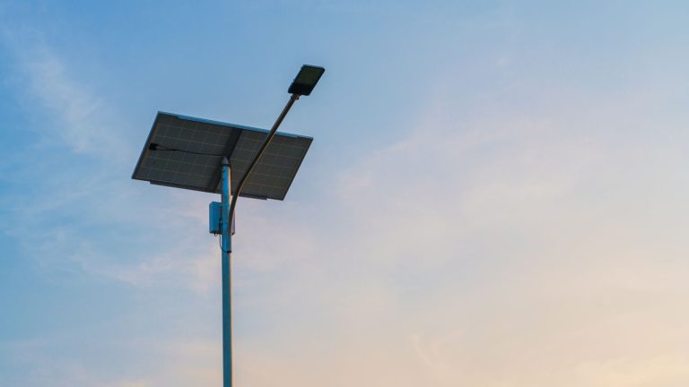 Street light pole with integrated solar technology