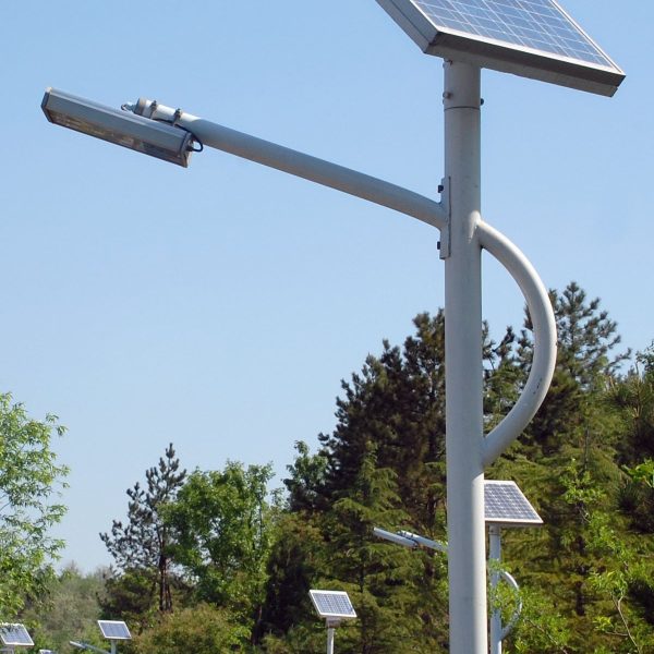 Trivenisolar lens street light mounted on a pole in an urban neighborhood